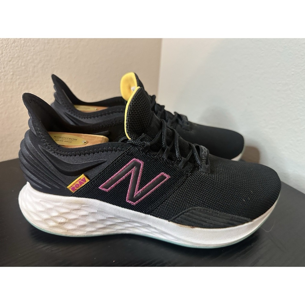 New Balance Black Athletic Sneakers with Pink and Yellow Accents